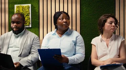 Black candidate filling in registration forms for job application and interview Stock Photos