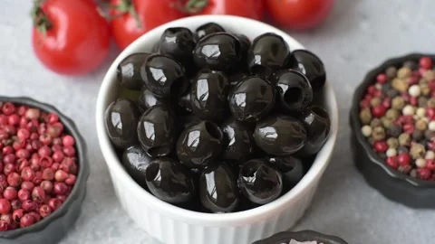 Black canned olives without pits for salads and snacks. Black olives without pit Stock Footage 338301550