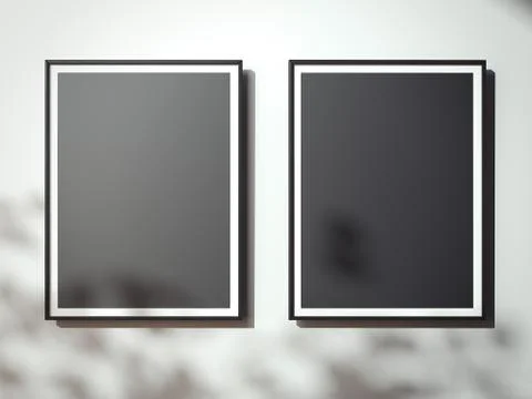 Black canvases on the white wall with shadows. 3d rendering Illustrazione stock
