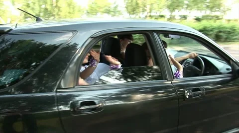 Black car with 4 brides inside Stock Footage 11224473