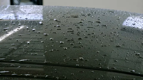 The black car is being washed with soap and water at a car wash. 4K Stock Footage 103418652