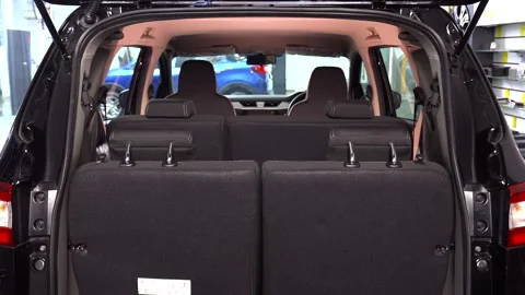 Black car boot space and folding the seat Stock Footage 267564766