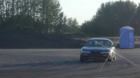 Black car drifting on closed course and doing donuts. Video stock 59747688