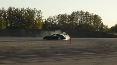 Black car drifts around corner and loses control at drifting event. Stock-Footage 59761923