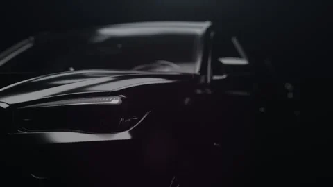 A black car with a dynamic backlight that forms glare on the car body Vídeo Stock 273474849