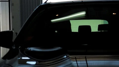 Black Car in a Garage Stock Footage 76471314