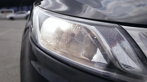 Black car headlights Stock Footage 130864790