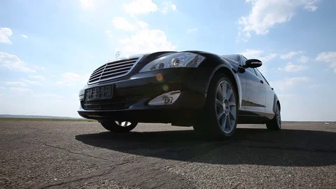 Black Car in motion Stock Footage 76768918