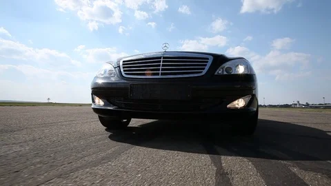 Black Car in motion Stock Footage 76769403