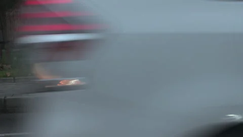 A black car is parked on the side of the road Vídeo Stock 326956026