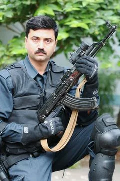 Black Cat commando with an AK 47 light machine gun MR 725 Copyright: xJaga... Stock Photos