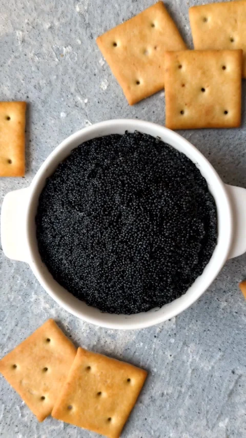 Black caviar from beluga or sturgeon, an expensive delicacy for sandwiches. Blac Stock Footage 336926558