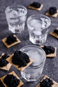 Black caviar on a cracker Stock Photos
