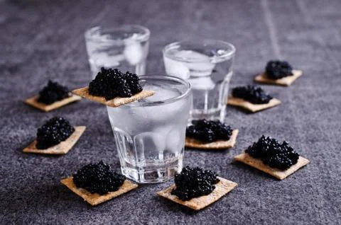 Black caviar on a cracker Stock Photos