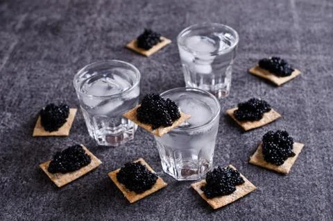 Black caviar on a cracker Stock Photos