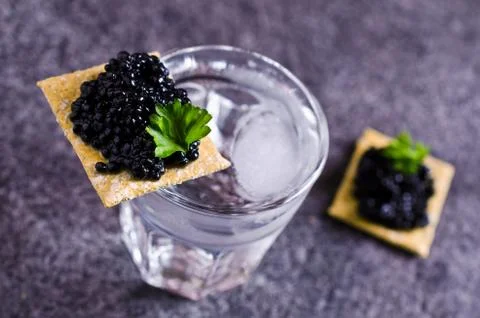 Black caviar on a cracker Stock Photos