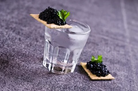 Black caviar on a cracker Stock Photos