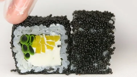 Black caviar exquisite rolls chef presentation in luxury japan restaurant sushi Stock Footage 80565395
