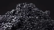 Black Caviar Isolated On Black Background, Close Up Rotation. Stock Footage