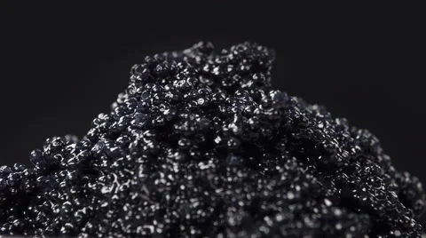 Black caviar isolated on black background, close-up rotation. 스톡 동영상 63535581