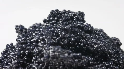 Black caviar isolated on white background, close-up rotation. Stock Footage 63535114