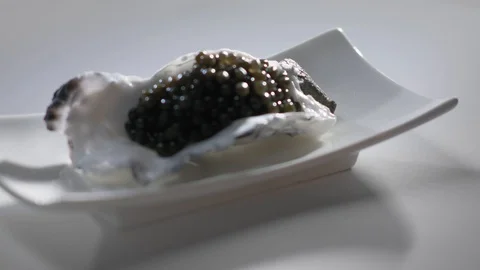 Black Caviar in Oyster Shell Stock Footage 107560044