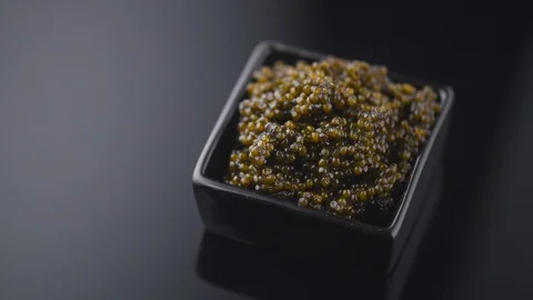 	 Black Caviar rotated background. High quality real natural sturgeon caviar Stock Footage 114242994