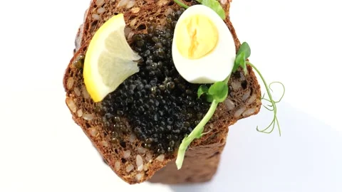 Black caviar served on bread Stock Footage 150509241
