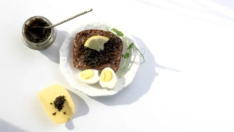 Black caviar served on bread Stock Footage 150509810