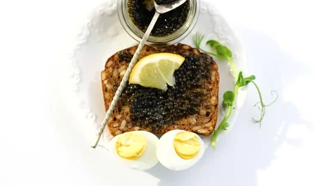 Black caviar served on bread Stock-Footage 150509939