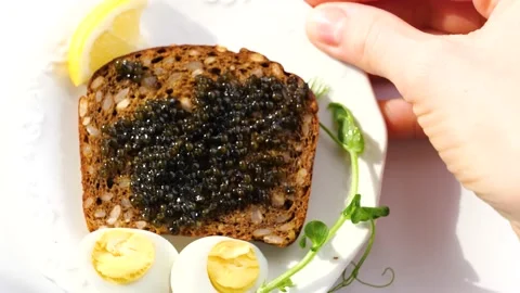 Black caviar served on bread Stock-Footage 150510045