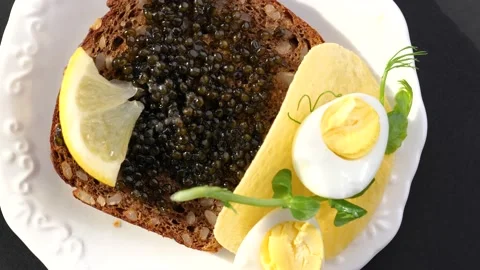 Black caviar served on bread Stock-Footage 150510288