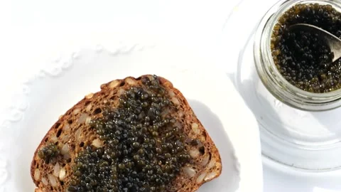 Black caviar served on bread Stock Footage 150518418