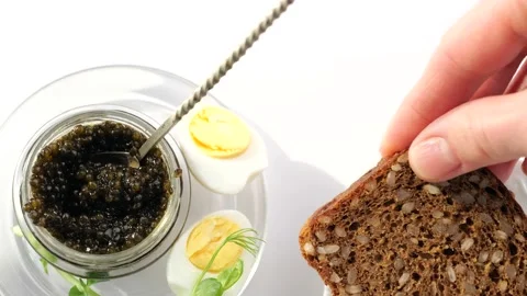 Black caviar served on bread, sndwiches preparing Stock-Footage 150517536