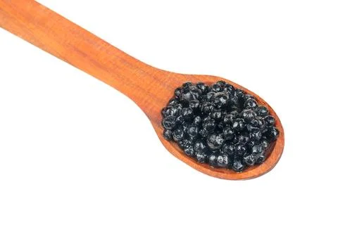 Black caviar in spoon Stock Photos