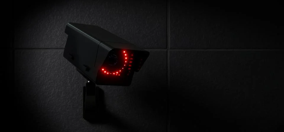 Black CCTV Security Camera with Red LED Lights on Dark Wall イラスト素材