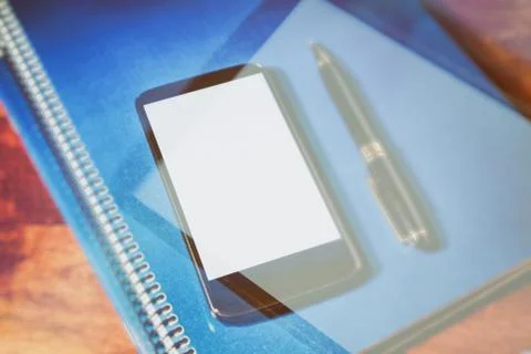 Black cellphone and notebook Stock Photos