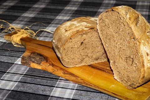 Black cereal bread arranged on a cutting board Stock Photos