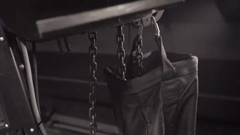 Black Chain Goes Down and Up From Electric Ceiling Chain Hoist. Stock Footage 302761193
