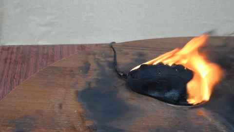Black charred burning computer mouse Video stock 140671046