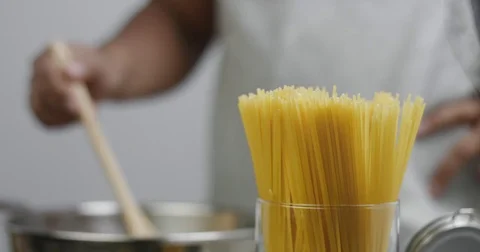 Black chef boiling spaghetti, close up Stock Footage 81615358