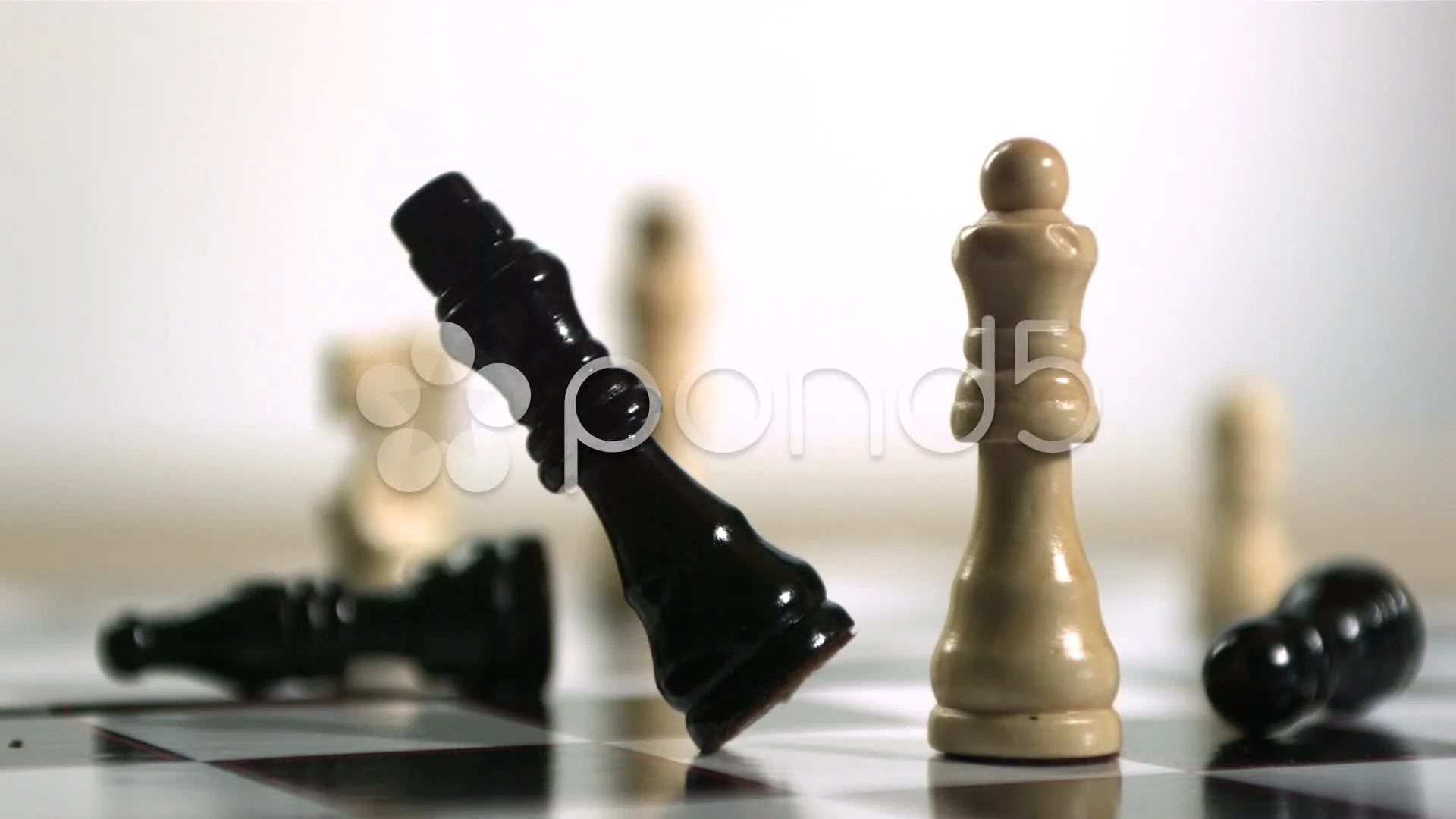 Black chess piece falling over, Stock Video