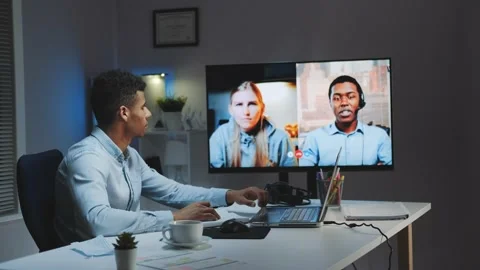 Black chief manager making video call on big monitor with colleagues on Video stock 131538835
