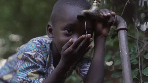 Black Child Drinking Water Stock Footage 97063380