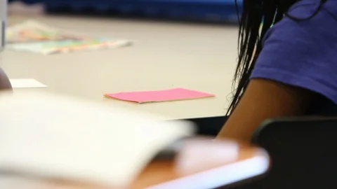 Black child reading notes Stock Footage 92496663