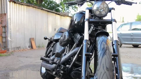Black chopper motorcycle standing outside Stock-Footage 135447669