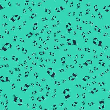 Black Christmas stocking icon isolated seamless pattern on green background Stock Illustration