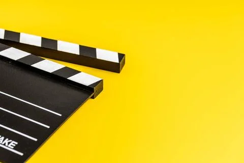 Black clapper board Black clapper board on yellow background. Copyright: x... Stock Photos