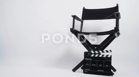 Black Clapper board or movie slate with director chair use in video production. Stock-Fotos