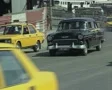 Black classic car driving along road SD Footage